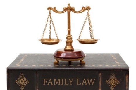 Picture of scales on top of family law book