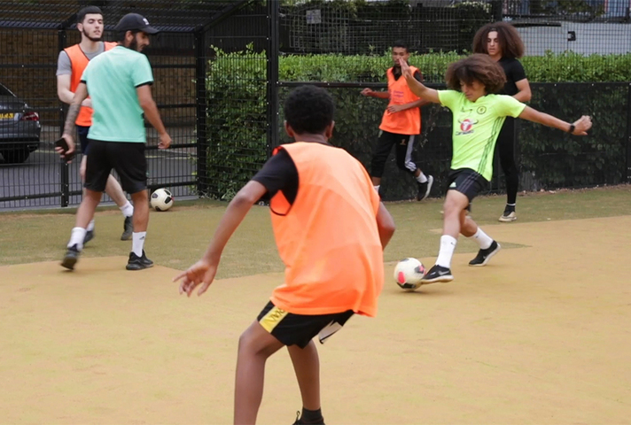 Footballers at a Queen’s Park Premier League Kicks coaching session
