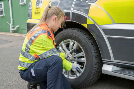Traffic Officer Hannah Moffitt checks tyres on a Highways England vehicle