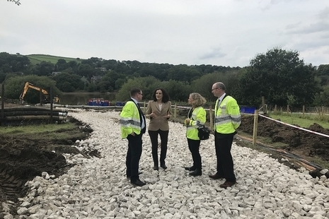 Theresa Villiers and Emma Howard-Boyd talking with officials at Whaley Bridge