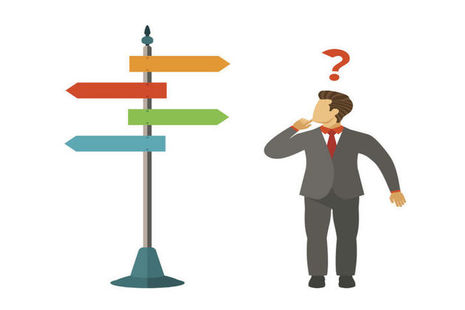 a man standing under a signpost
