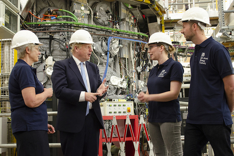 Prime Minister Boris Johnson at the MAST Upgrade fusion experiment with UKAEA staff (left to right): Nanna Heiberg, Stephanie Hall and Matthew Carr.