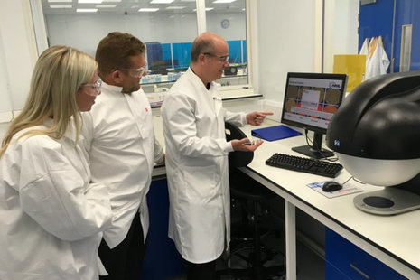 Visitors being shown around the laboratory