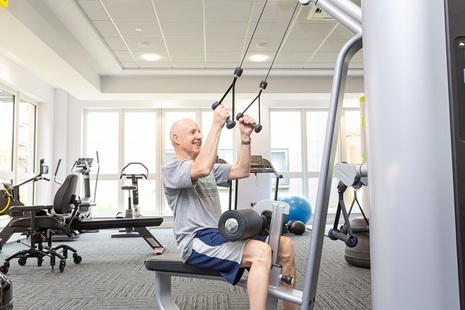 Man doing strength exercises in gym