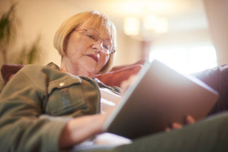 Woman sitiing using a tablet pc