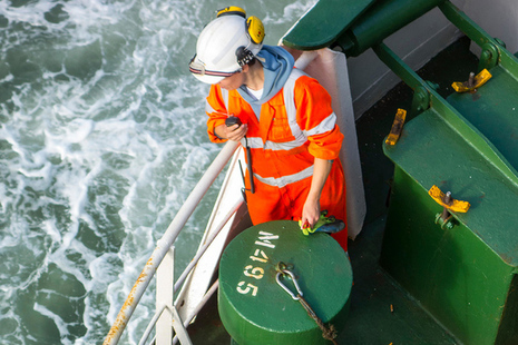 Female crew member on deck of merchant ship