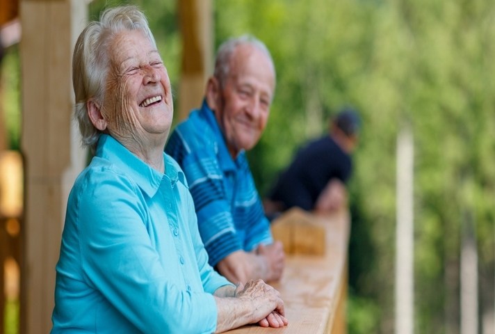 older man and woman having a laugh