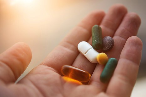 Hand holding pills