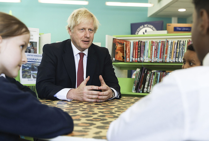 Prime Minister Boris Johnson speaking to pupils in school library