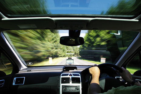 In-car view of a car being driven along a road