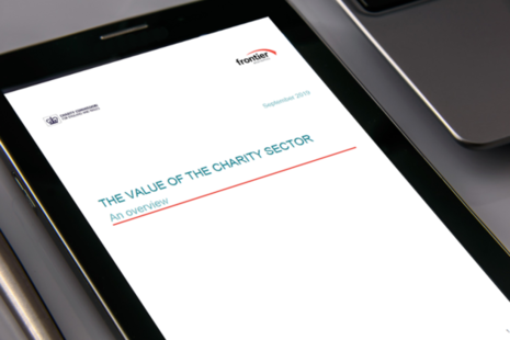 A tablet computer displaying the front cover of our paper 'The value of charity'.