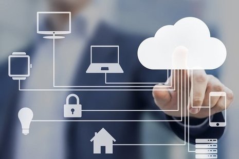 Man pointing at image of cloud on a screen