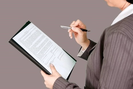 Person with clipboard and pen