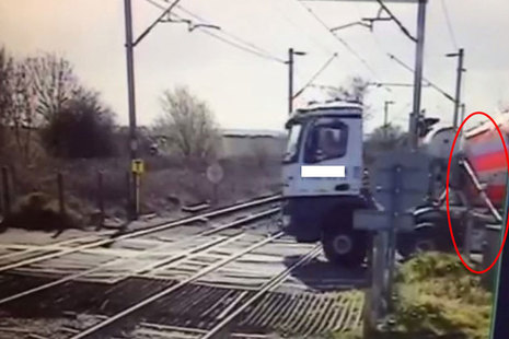 CCTV view of the stationary lorry and partly lowered level crossing barrier (highlighted) courtesy of Network Rail
