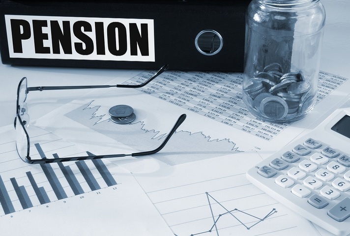 Pensions file with glasses and charts