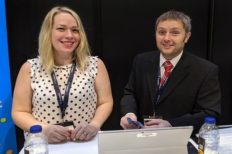 Two Companies House employees smiling at the camera