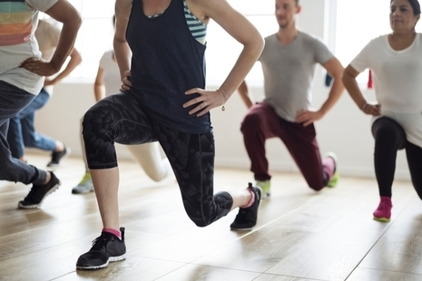 Group of people stretching in an exercise class