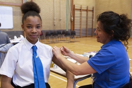 School girl being vaccinated