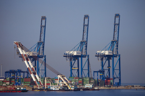 View of cranes and containers at a port