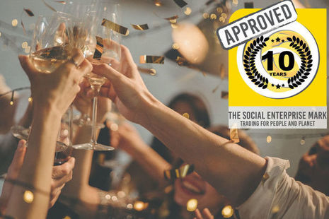 hands holding wine glasses toasting each other