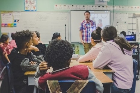 male teacher in classroom