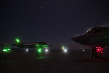 F35 Lightning jets on deck at sunset. Crown Copyright