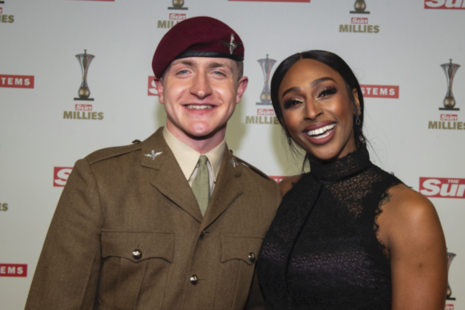 Pte Fin Doherty, who won the Inspiring Others award, stands with Alexandra Burke on the red carpet