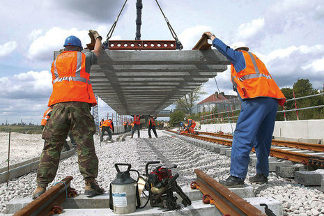 Laying railway track.