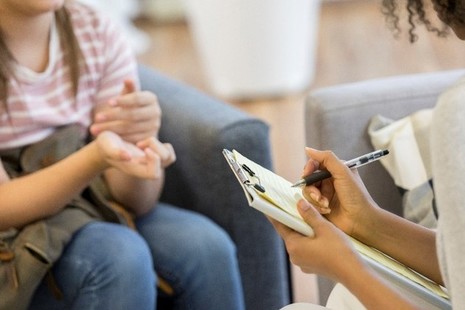 care worker talking to a young person