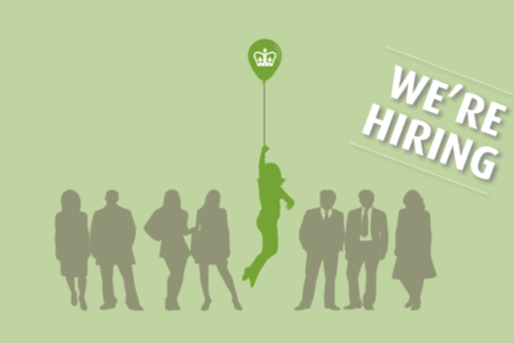 A group of people with one person being lifted up by a balloon that displays the Charity Commission logo. Also has the words 'We're hiring'.