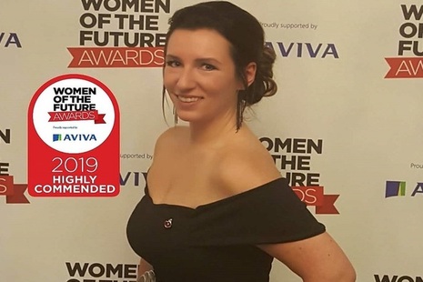 Portrait image of Rebecca Ballantyne receiving an outstanding acheivement award in 2019