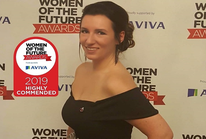Portrait image of Rebecca Ballantyne receiving an outstanding acheivement award in 2019