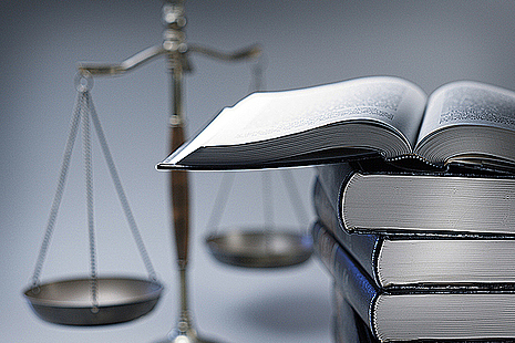 Scales of justice and legal papers