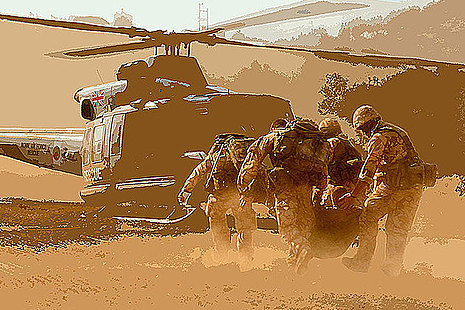 Medics carrying soldier to aircraft