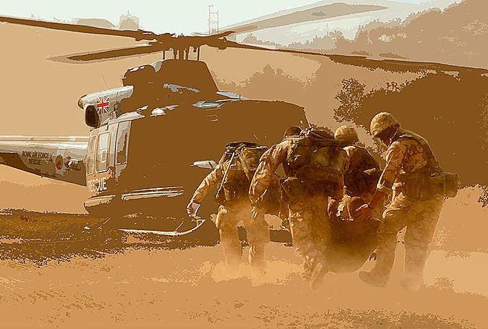Medics carrying soldier to aircraft