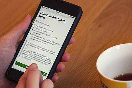 A mobile phone displaying HM Land Registry's digital mortgage service