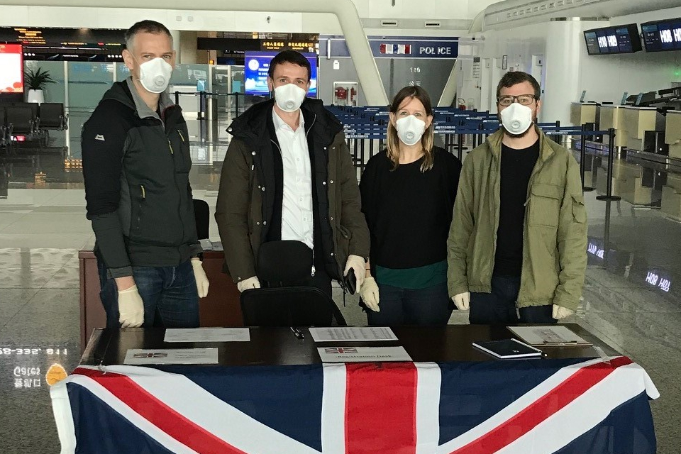 Matt Crow and colleagues at Wuhan airport