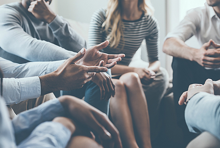 An image of people discussing.