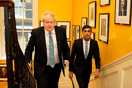 Chancellor and Prime Minister climbing stairs in number ten