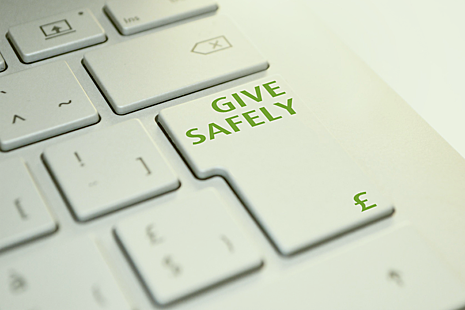 A keyboard with the words 'give safely' on the enter key.