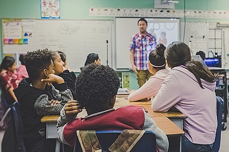 Male teacher in classroom