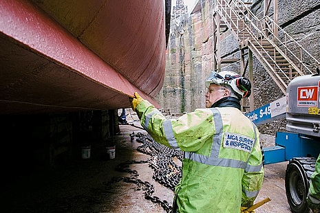 Surveyor inspecting hull