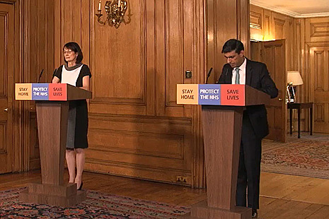 Chancellor standing at podium.