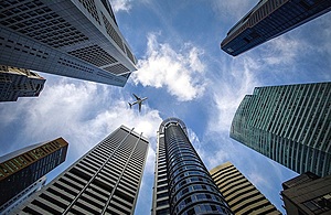 Plane flying over skyscrapers Singapore