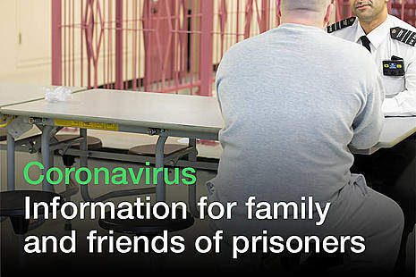 prisoner sitting down with person