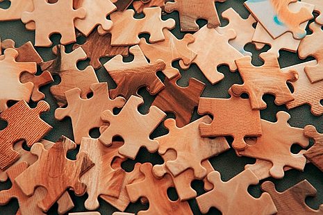 Brown jigsaw puzzle pieces