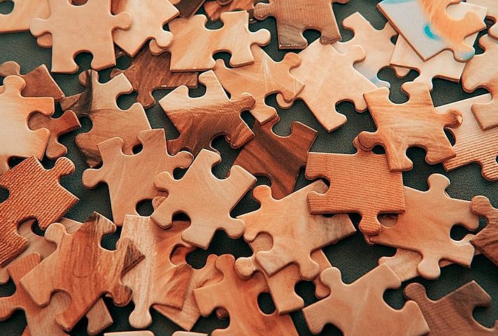 Brown jigsaw puzzle pieces