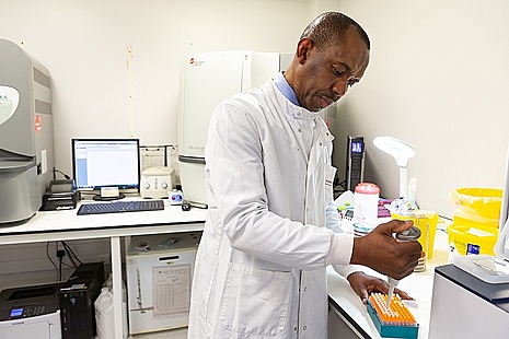 Lab assistant performing generic test in NHS lab