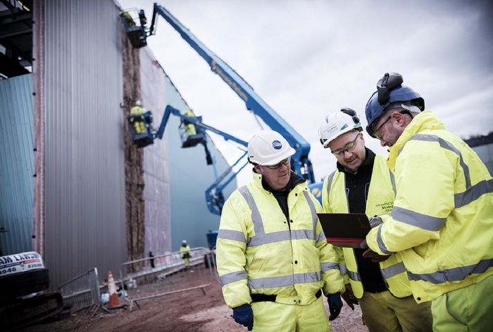 Image of the construction site with Sellafield employees in the foreground