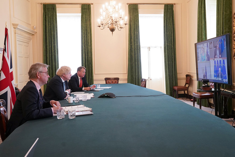 The Prime Minister Boris Johnson inside the Cabinet Room of No10 Downing Street joined by Europe Adviser and Chief Negotiator of Task Force Europe David Frost and Minister for the Cabinet Office Michael Gove.